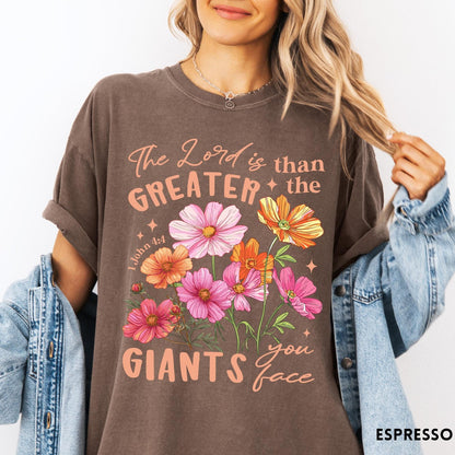 Comfort Colors tee in Espresso featuring floral Bible verse graphic design with 1 John 4:4 scripture text