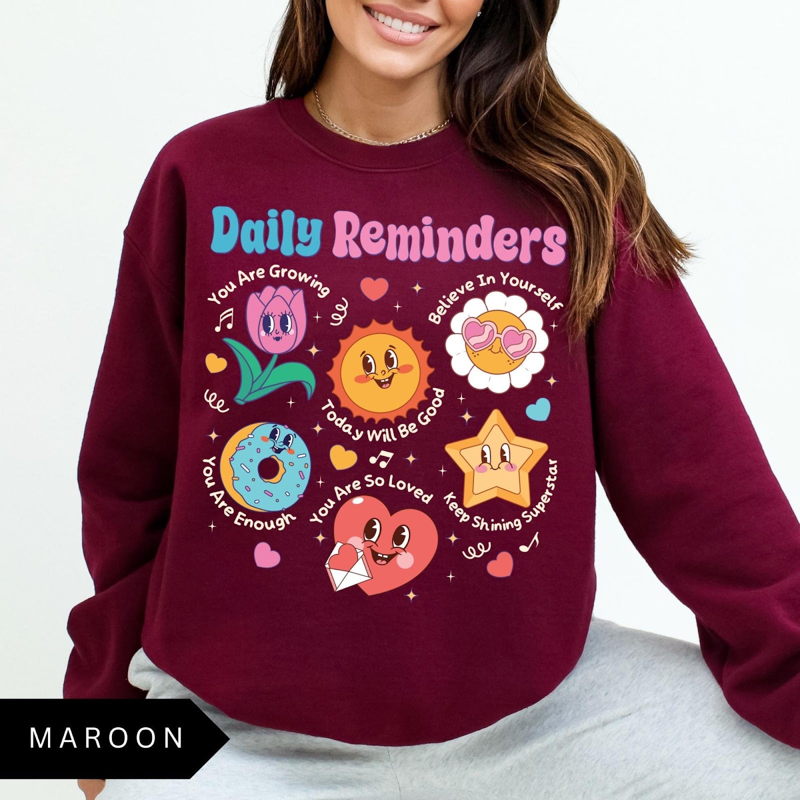 Comfort Colors tee in Maroon featuring retro mascot design with daily affirmations and cute cartoon characters