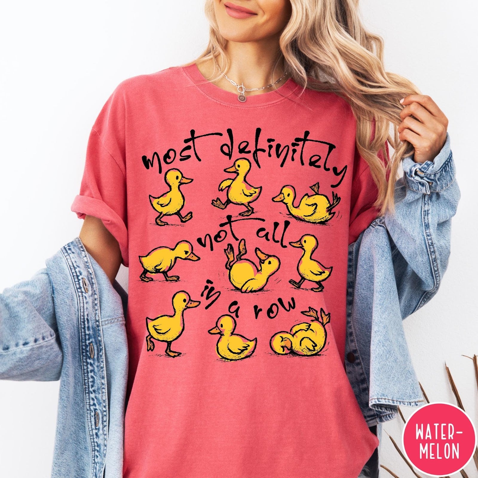 Comfort Colors tee in Watermelon featuring whimsical duck graphic with text most definitely not all in a row.