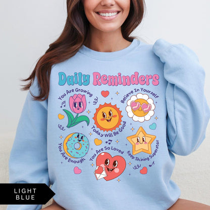 Comfort Colors tee in Light Blue featuring retro mascot design with daily affirmations and cute cartoon characters
