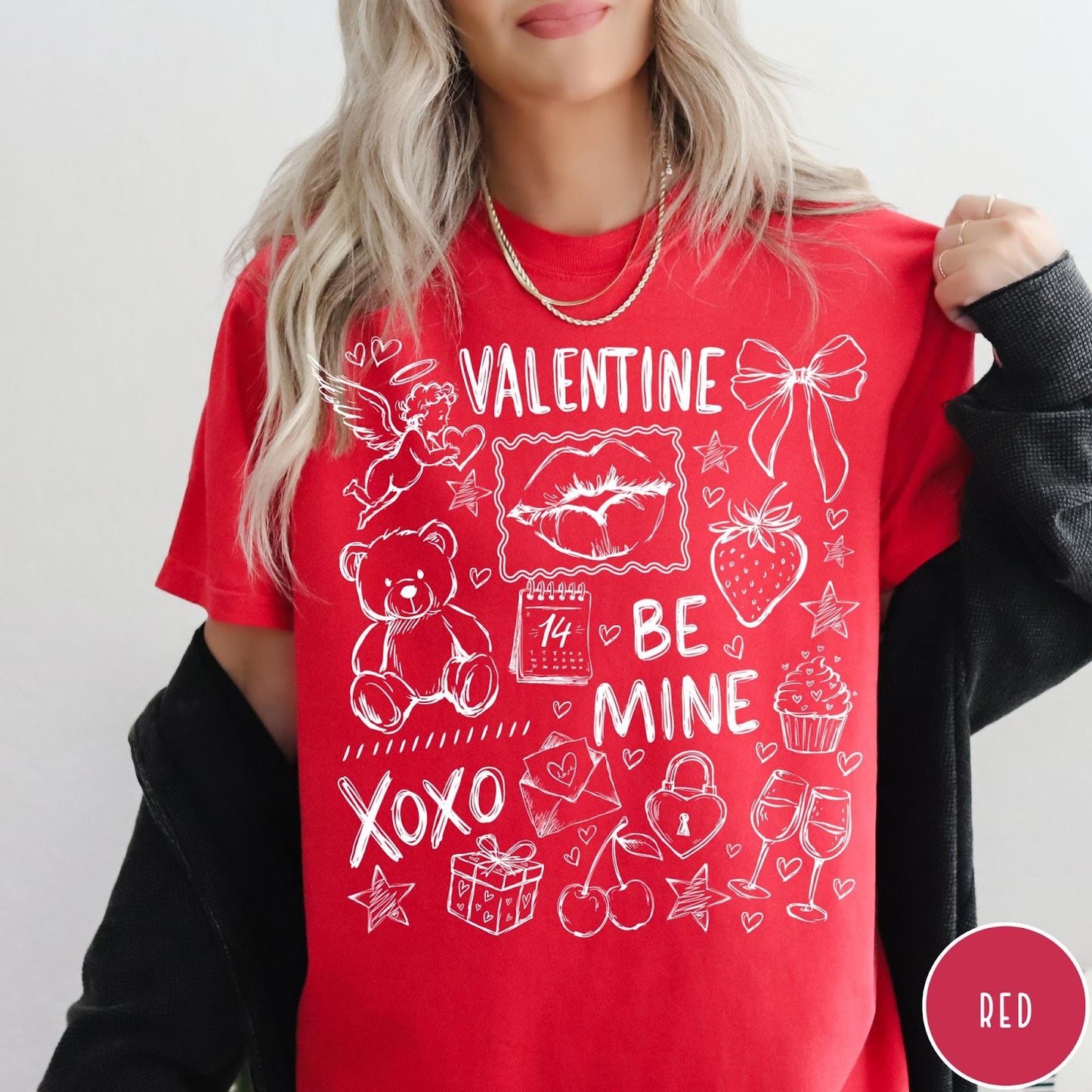 Comfort Colors tee in Red featuring sketch style Valentine's Day collage graphic with cupid, bear, and hearts