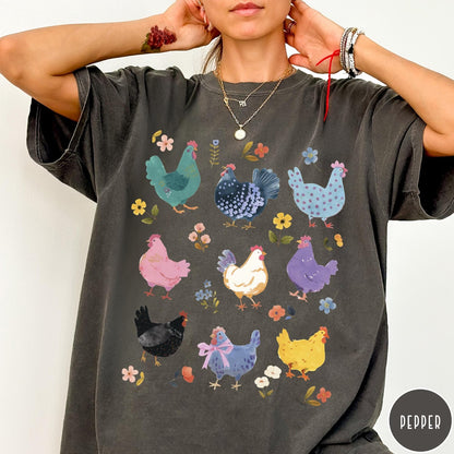Comfort Colors tee in Pepper featuring vintage style graphic with various colorful chickens and small floral accents