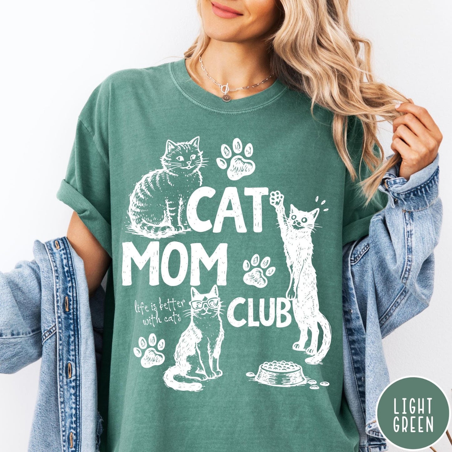 Comfort Colors tee in Light Green featuring vintage style graphic with cats, paw prints, and cat mom club text