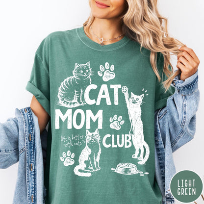 Comfort Colors tee in Light Green featuring vintage style graphic with cats, paw prints, and cat mom club text