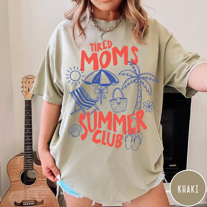 Comfort Colors tee in Khaki featuring beach vacation graphic with sun, palm tree, umbrella, and summer text
