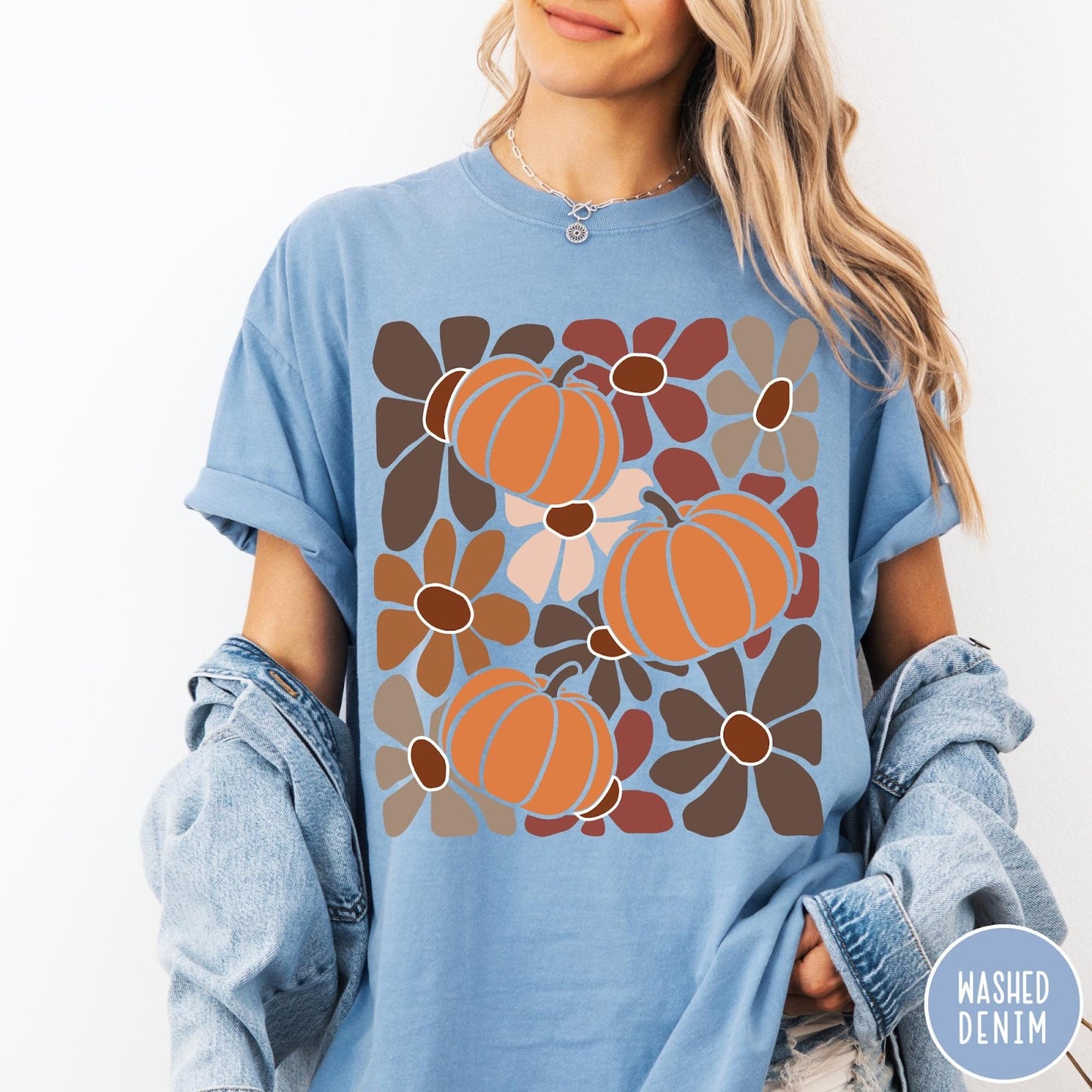 Comfort Colors tee in Washed Denim featuring boho floral style graphic with three orange pumpkins and brown flowers