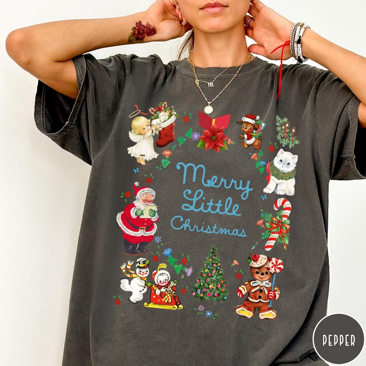 Comfort Colors tee in Pepper featuring vintage style holiday characters including Santa, a snowman, and gingerbread man.