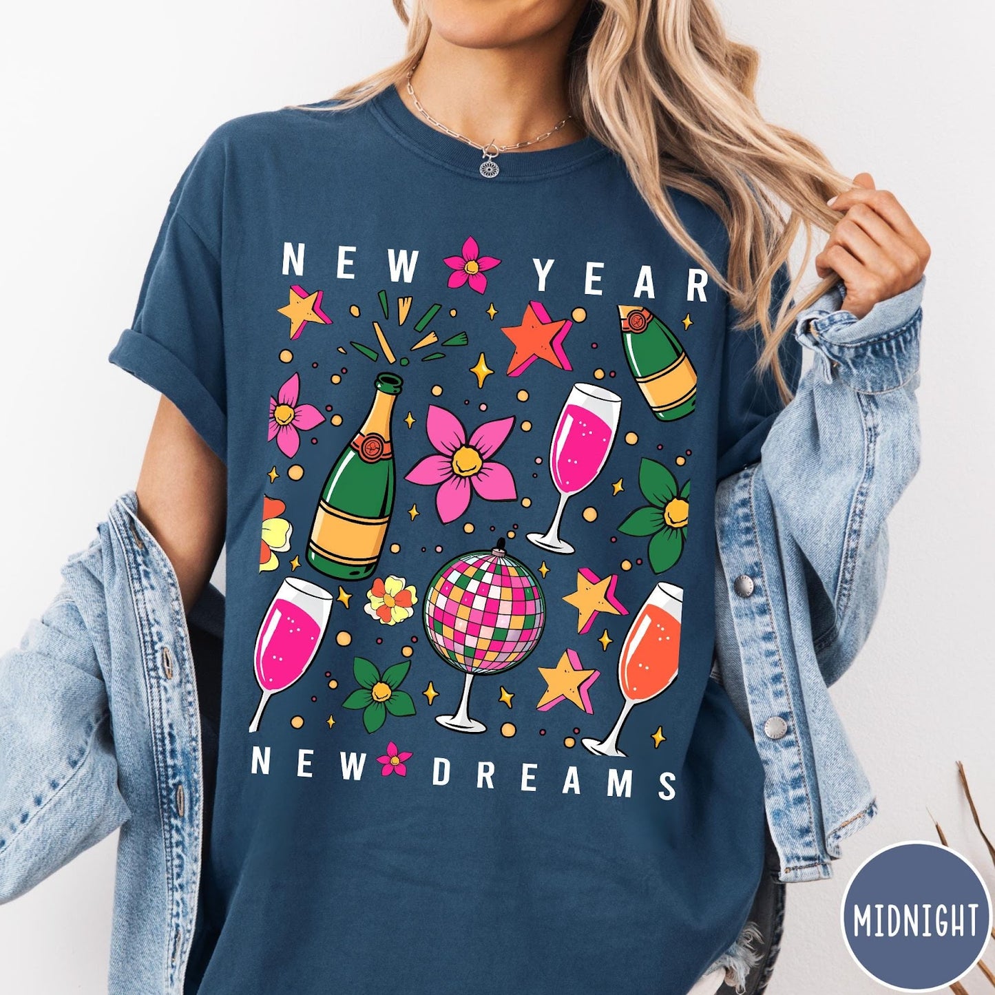 Comfort Colors tee in Midnight featuring New Year celebration graphic with champagne bottles, glasses, and disco ball