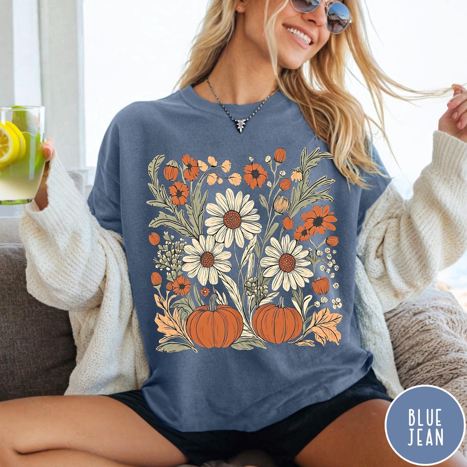 Comfort Colors tee in Blue Jean featuring boho floral design with pumpkins and daisies in fall colors