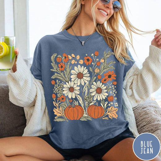 Comfort Colors tee in Blue Jean featuring boho floral design with pumpkins and daisies in fall colors