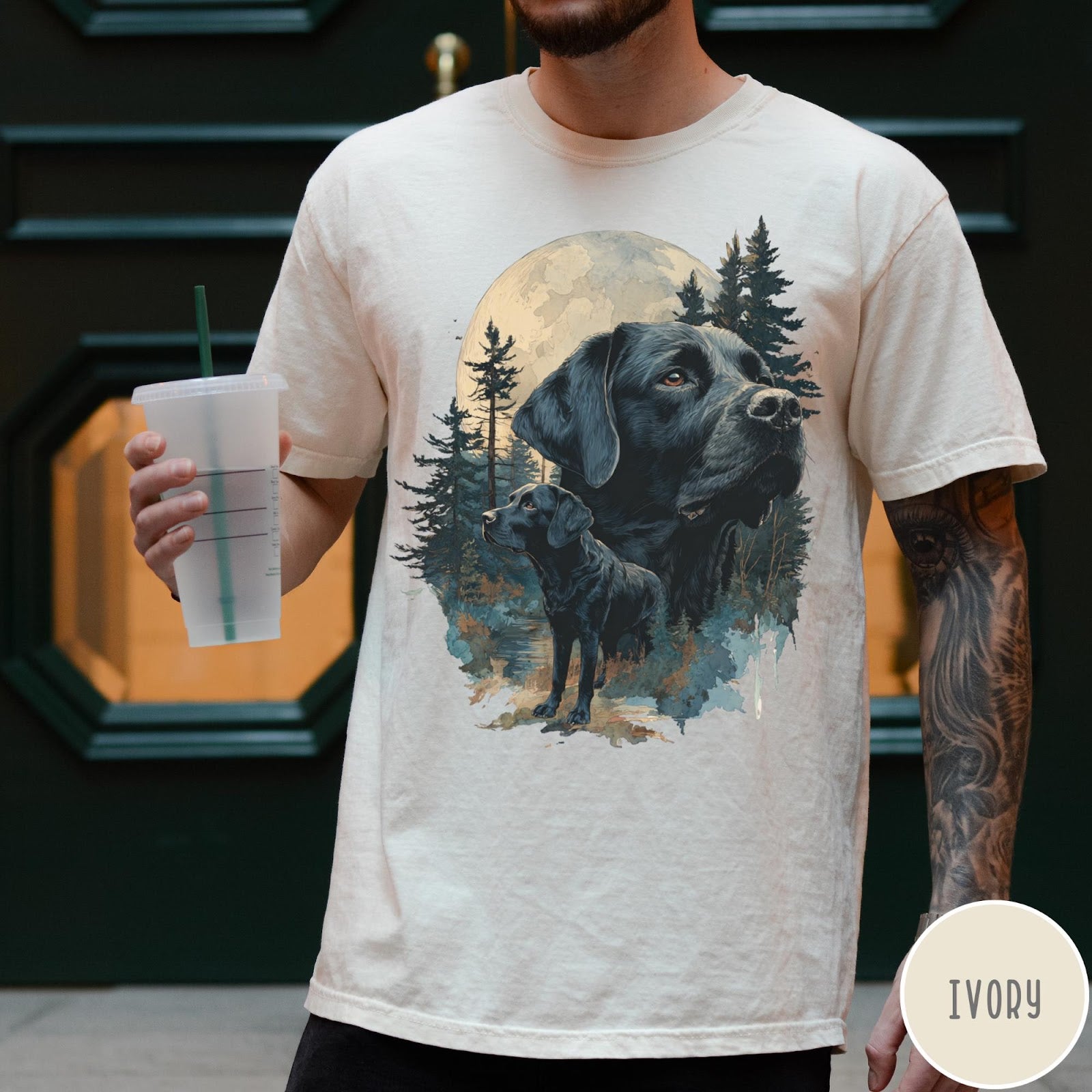 Comfort Colors tee in Ivory featuring nature style graphic of black Labrador dogs in a forest moon scene