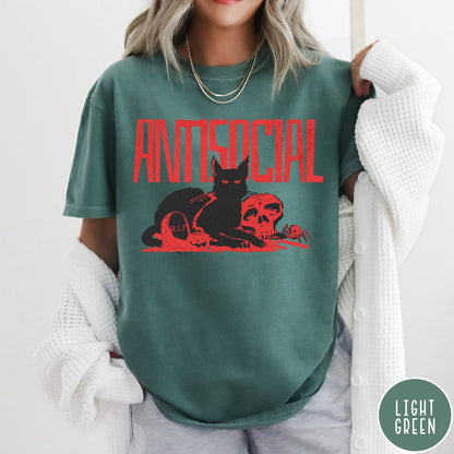 Comfort Colors tee in Light Green featuring retro graphic design of a black cat with skull and tombstone