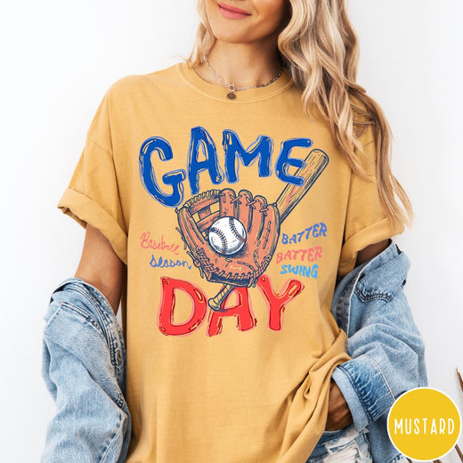 Comfort Colors tee in Mustard featuring baseball design with glove, ball, bat, and Game Day text graphic