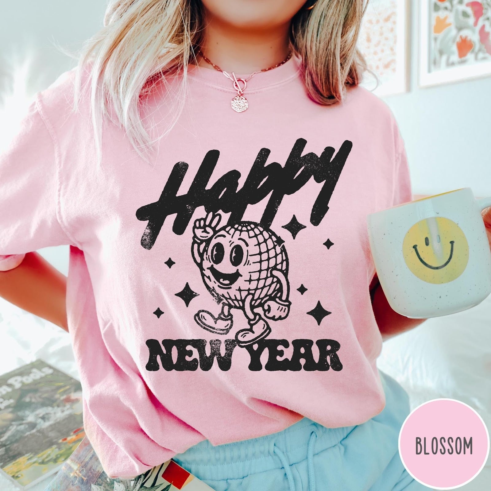 Comfort Colors tee in Blossom featuring retro disco style graphic of a happy disco ball mascot character
