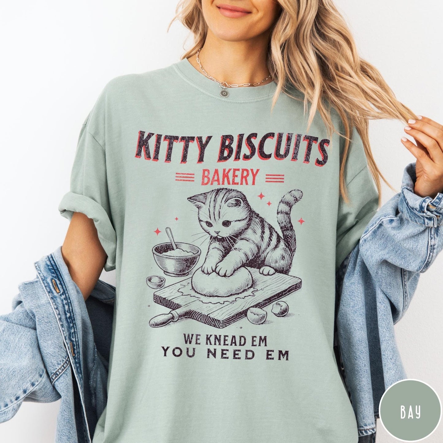 Comfort Colors tee in Bay featuring vintage style graphic of a cat baking biscuits on board