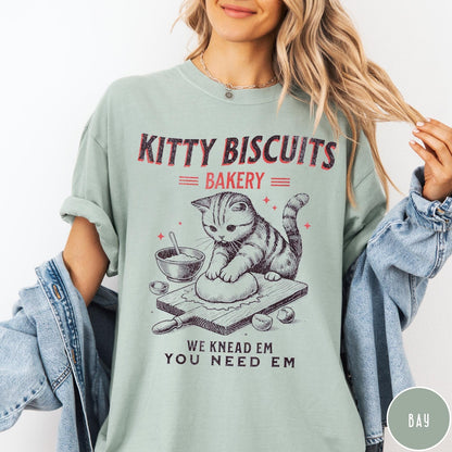 Comfort Colors tee in Bay featuring vintage style graphic of a cat baking biscuits on board