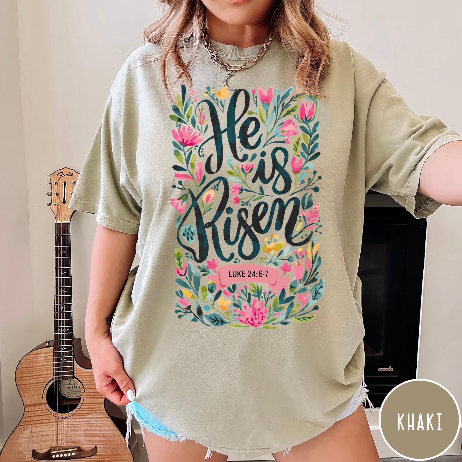 Comfort Colors tee in Khaki featuring religious floral design with He is Risen text graphic