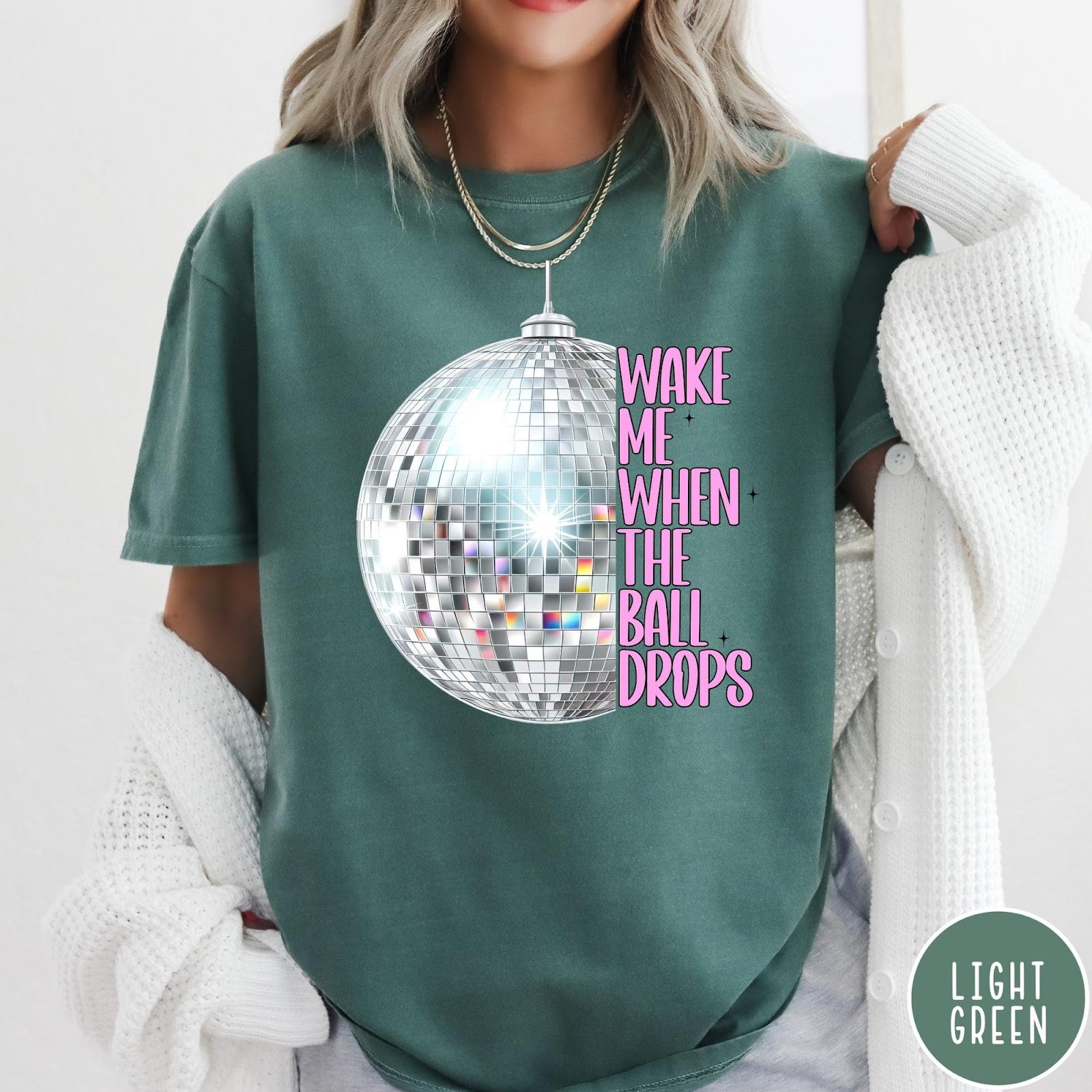 Comfort Colors tee in Light Green featuring disco ball graphic with text Wake Me When The Ball Drops