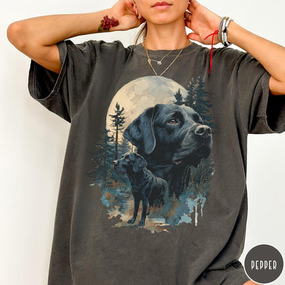 Comfort Colors tee in Pepper featuring nature style graphic of black Labrador dogs in a forest moon scene