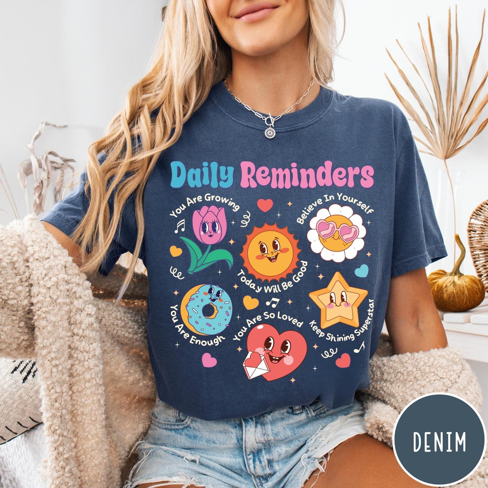 Comfort Colors tee in Denim featuring retro mascot design with daily affirmations and colorful cartoon characters