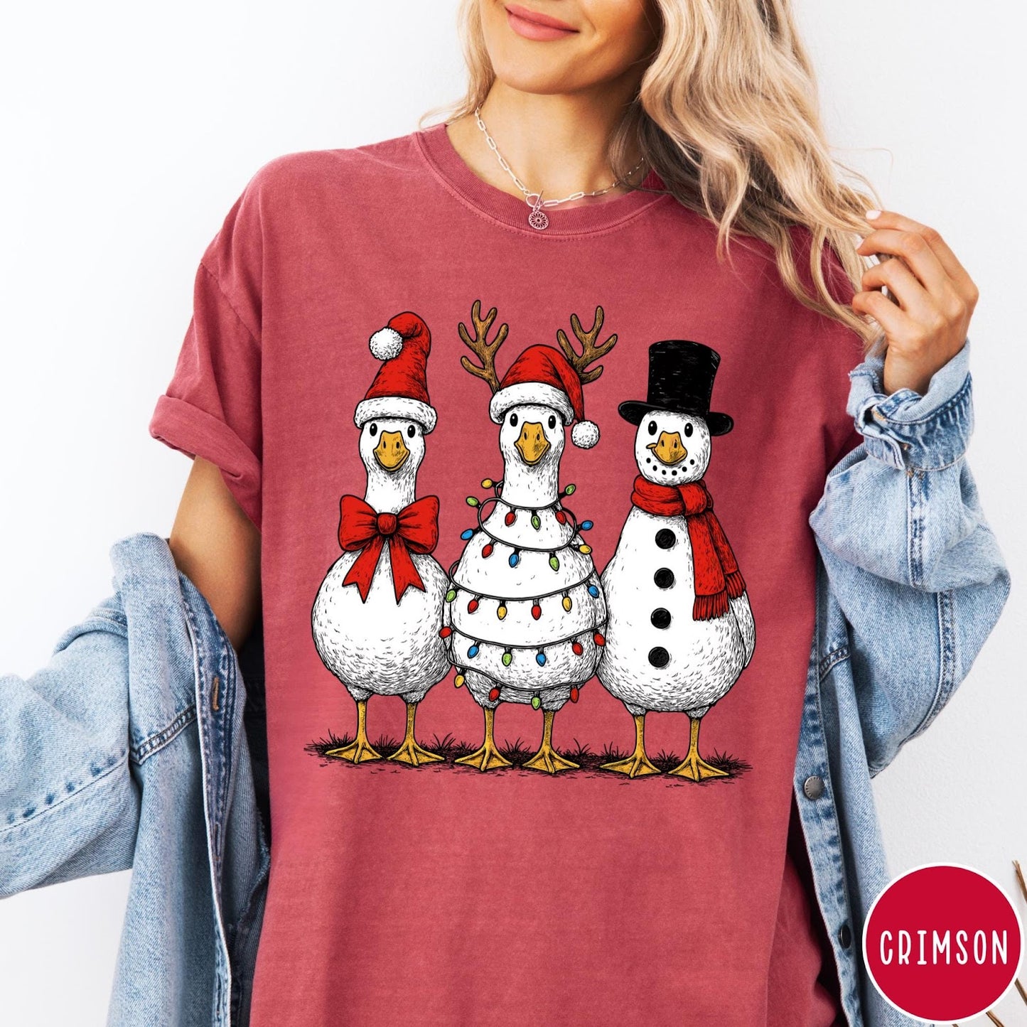Comfort Colors tee in Crimson featuring festive holiday graphic of three geese dressed as Santa and snowman
