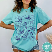 Comfort Colors tee in Chalky Mint featuring vintage bird tattoo style graphic with various birds and flowers