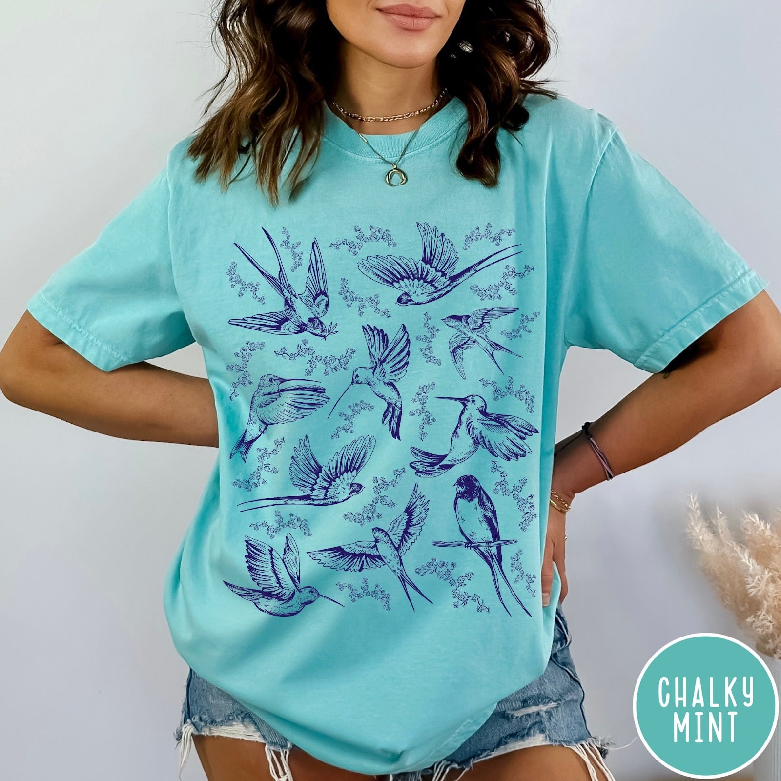 Comfort Colors tee in Chalky Mint featuring vintage bird tattoo style graphic with various birds and flowers