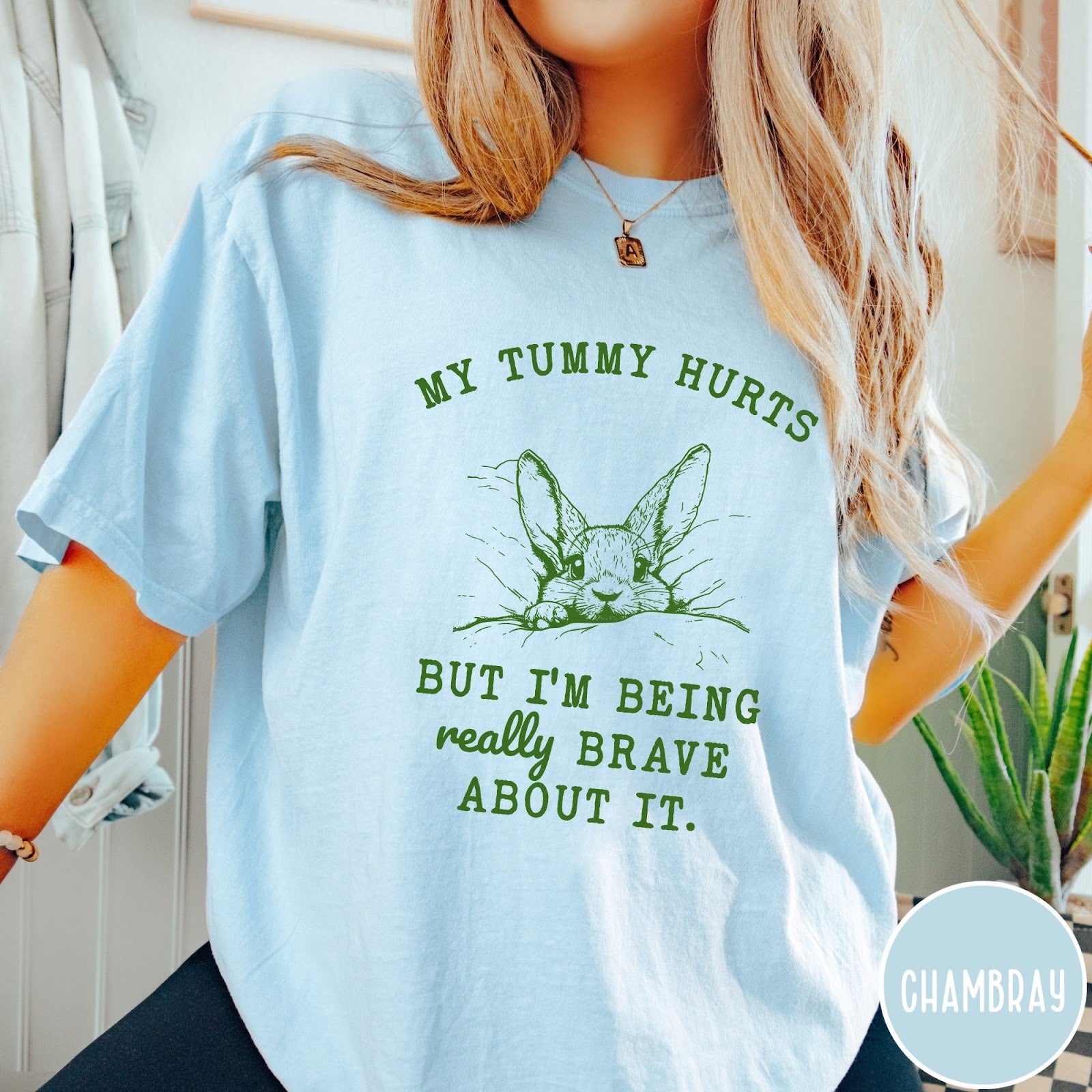 Comfort Colors tee in Chambray featuring line art graphic of a bunny with text My Tummy Hurts