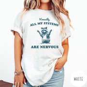 Comfort Colors tee in White featuring graphic illustration of a nervous raccoon with arms raised in air