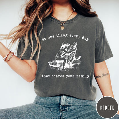 Comfort Colors tee in Pepper featuring vintage style graphic of a girl wrestling an alligator