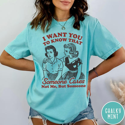 Comfort Colors tee in Chalky Mint featuring vintage style graphic of two women comforting each other with text