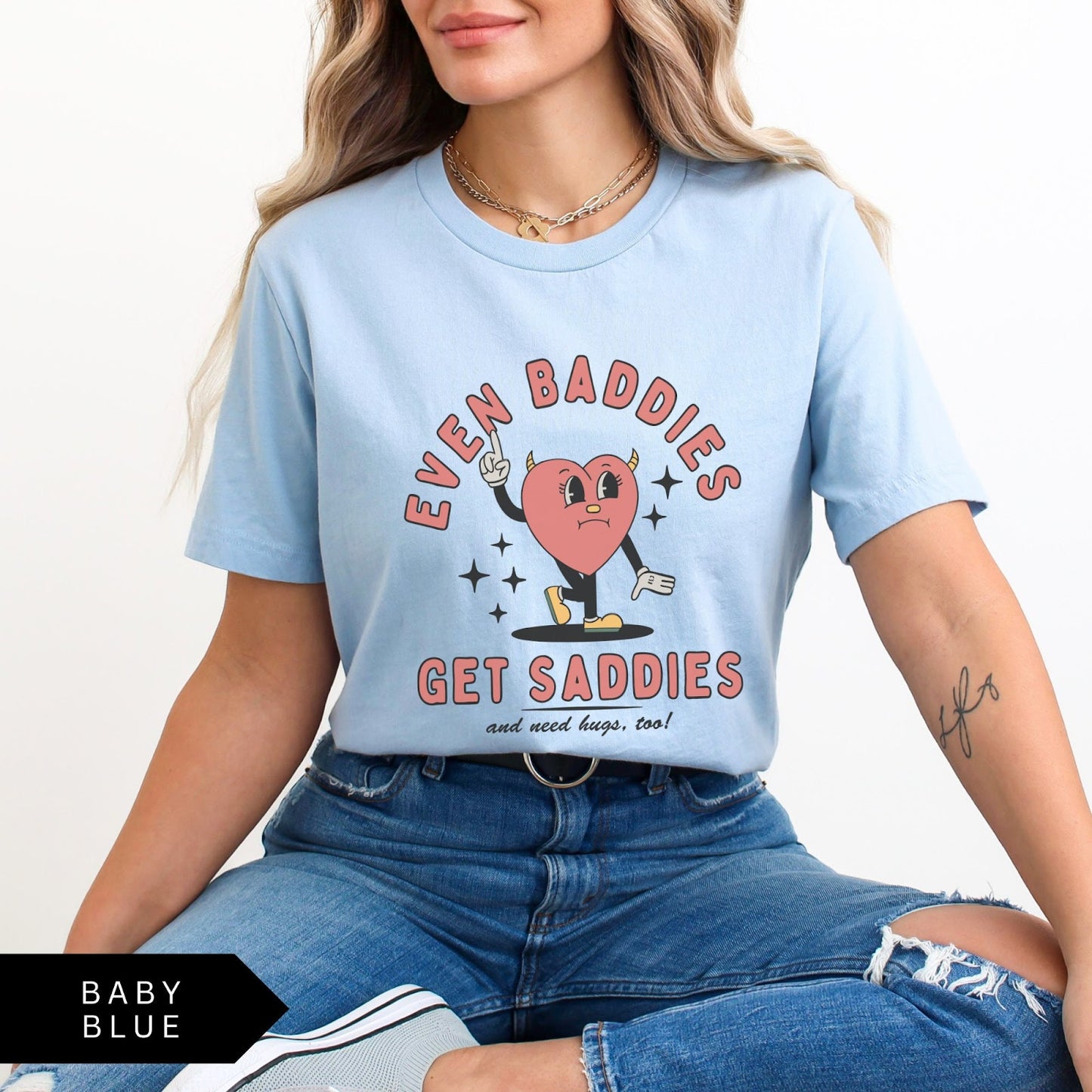 Comfort Colors tee in Baby Blue featuring retro style sad heart character with horns and text graphic