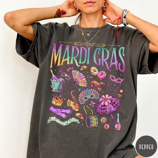 Comfort Colors tee in Pepper featuring vintage style Mardi Gras icons including a saxophone, mask, and umbrella.