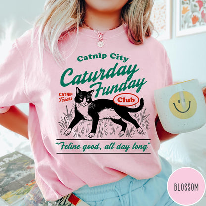 Comfort Colors tee in Blossom featuring vintage style graphic of a tuxedo cat in grass with text