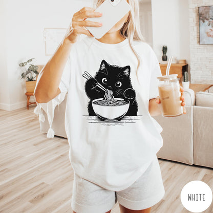 Comfort Colors tee in White featuring graphic illustration of a cute black cat eating a bowl of ramen