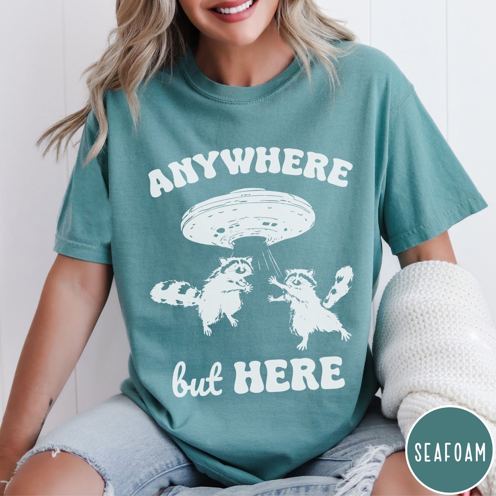 Comfort Colors tee in Seafoam featuring whimsical graphic style with two raccoons being abducted by a UFO
