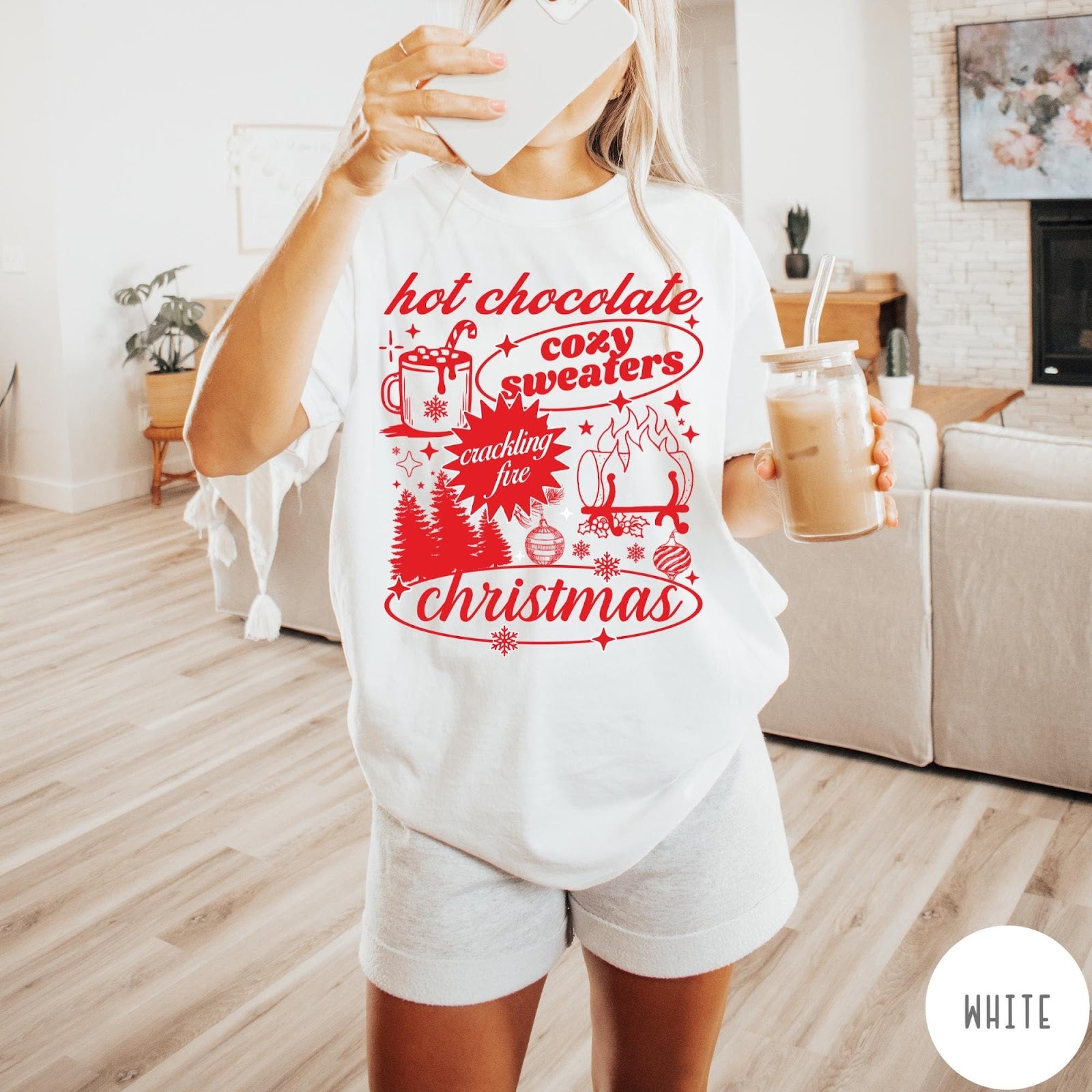 Comfort Colors tee in White featuring holiday graphic design with hot chocolate, fire, and Christmas trees