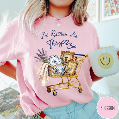 Comfort Colors tee in Blossom featuring vintage style graphic of a shopping cart filled with antique decor items