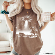 Comfort Colors tee in Espresso featuring western graphic style with a cowboy riding a horse under a UFO