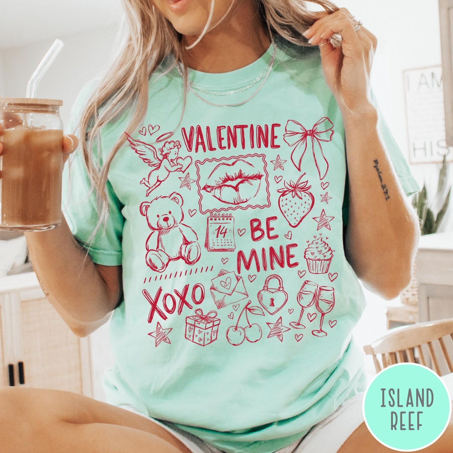 Comfort Colors tee in Island Reef featuring Valentine's Day collage graphic with cupid, teddy bear, and romantic symbols
