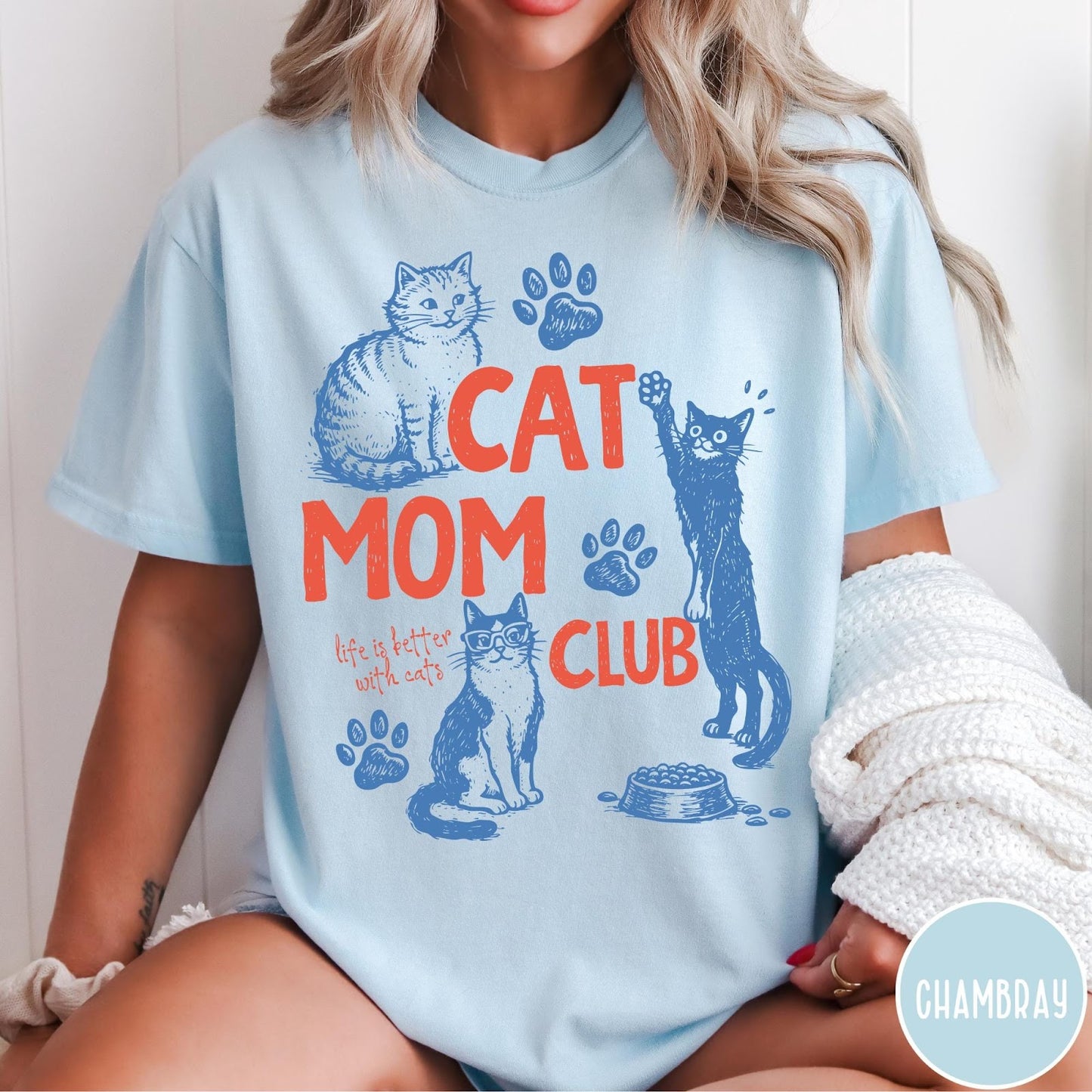 Comfort Colors tee in Chambray featuring graphic illustration of cats, paw prints, and Cat Mom Club text