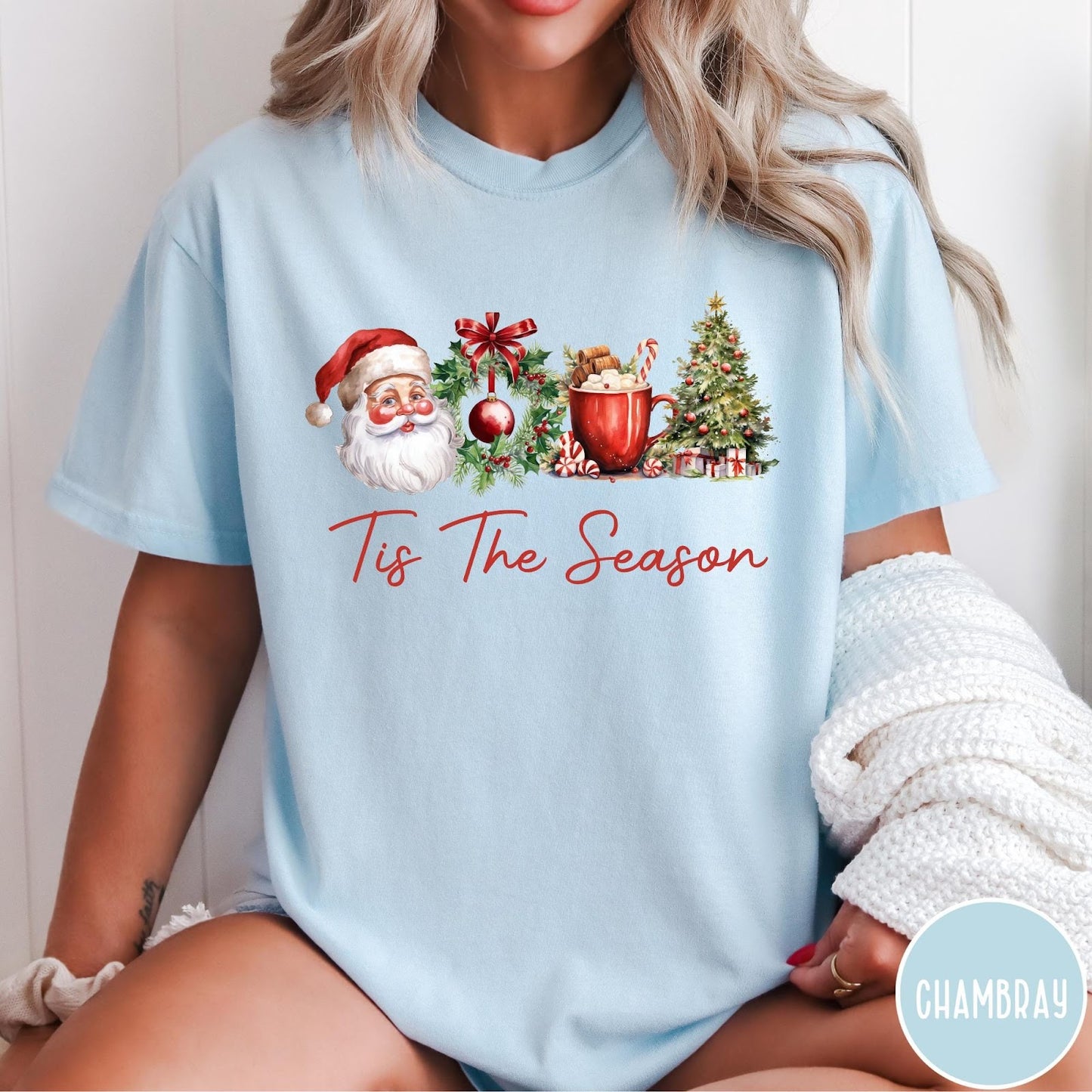Comfort Colors tee in Chambray featuring holiday design with Santa, wreath, hot cocoa, and Christmas tree graphic