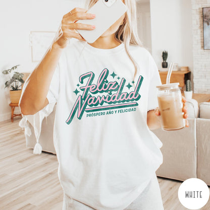 Comfort Colors tee in White featuring retro Christmas style Feliz Navidad greeting with stars and holiday text