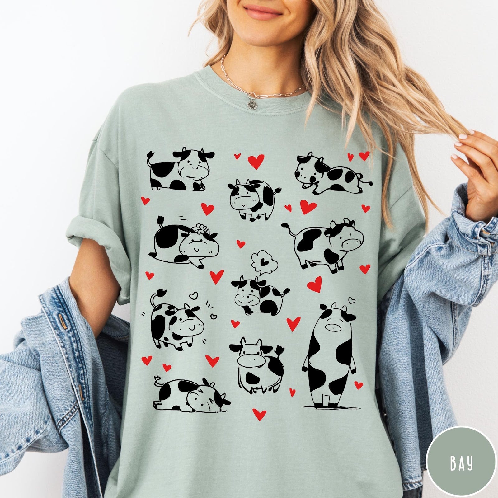 Comfort Colors tee in Bay featuring cute cow lover graphic with various black and white cow illustrations