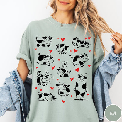 Comfort Colors tee in Bay featuring cute cow lover graphic with various black and white cow illustrations