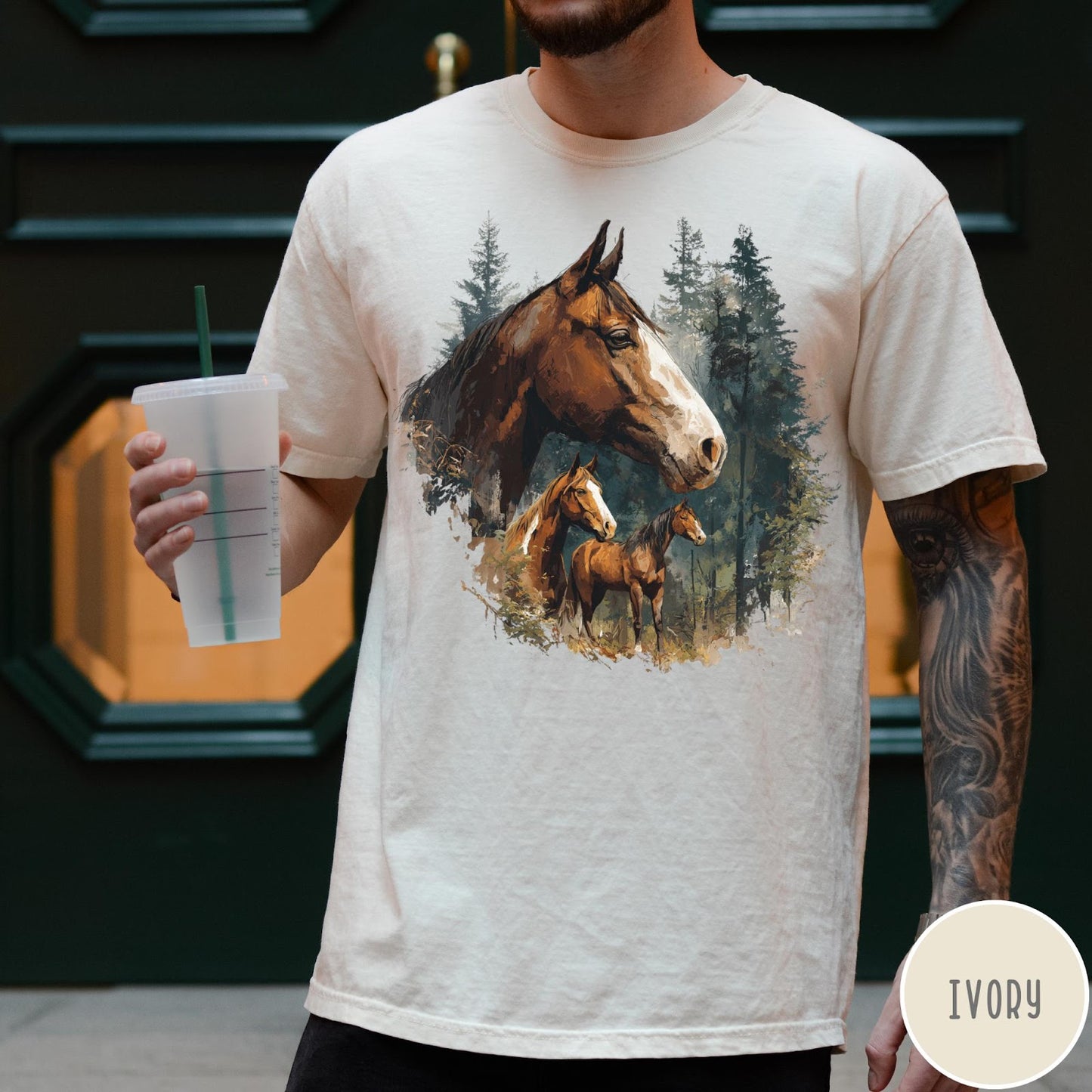 Comfort Colors tee in Ivory featuring vintage style graphic of three horses standing in a pine forest