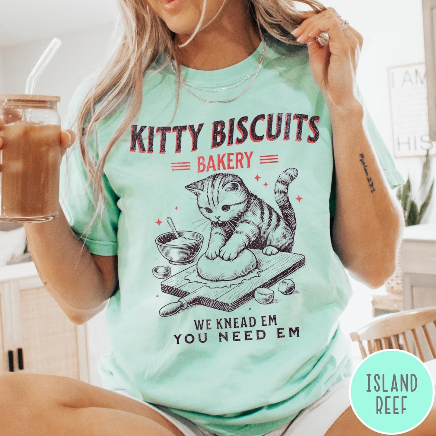 Comfort Colors tee in Island Reef featuring vintage style graphic of a cat baking biscuits on board