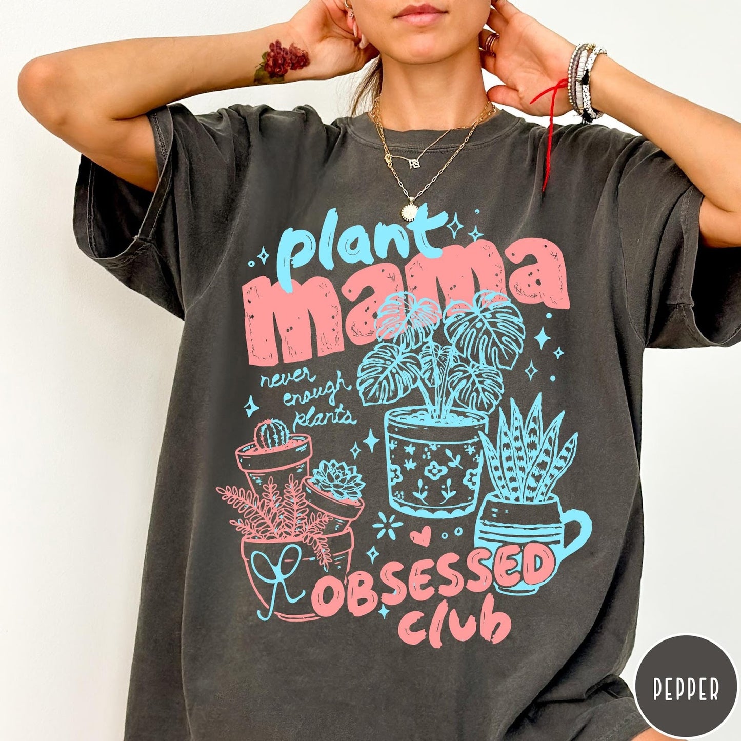Comfort Colors tee in Pepper featuring retro style graphic with potted plants and Plant Mama Obsessed Club text