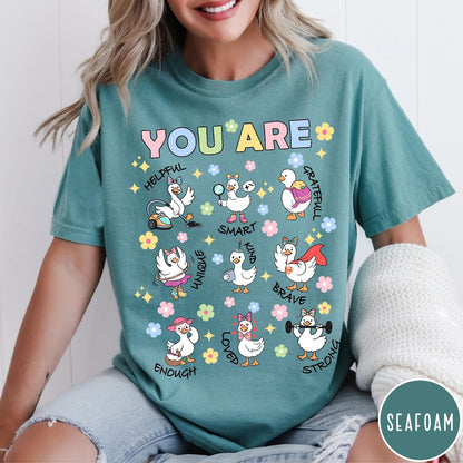 Comfort Colors tee in Seafoam featuring cute cartoon duck graphic with inspirational words like kind and brave