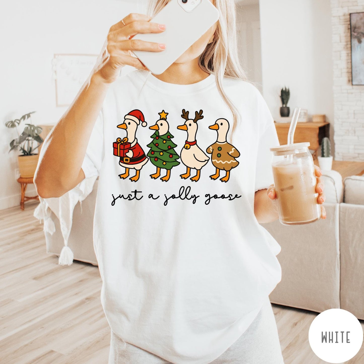 Comfort Colors tee in White featuring festive geese dressed as Santa, Christmas tree, reindeer, and gingerbread